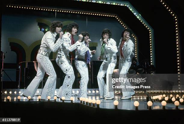 The Osmonds on stage at the London Palladium circa 1973 in London, England.