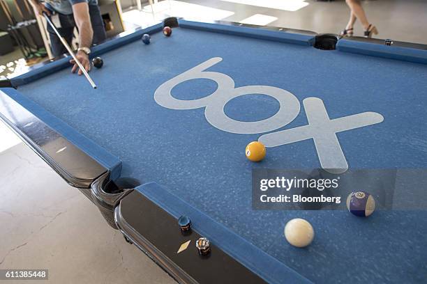 An employee plays a game of pool at Box Inc. Headquarters in Redwood City, California, U.S., on Monday, Sept. 26, 2016. Box Inc., trying to expand...