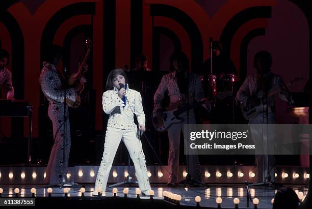 Jimmy Osmond and The Osmonds on stage at the London Palladium circa 1973 in London, England.