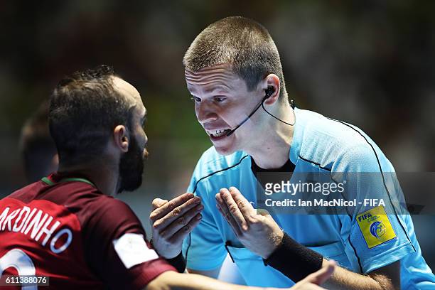 Ricardinho of Portugal is spoken to by a match official during the FIFA Futsal World Cup Semi Final match between Argentina and Portugal at the...