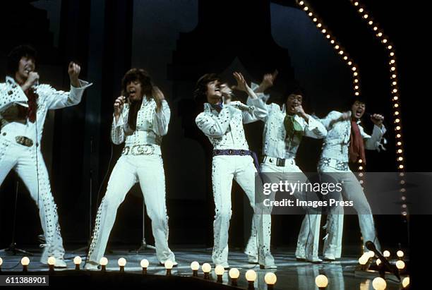 The Osmonds on stage at the London Palladium circa 1973 in London, England.