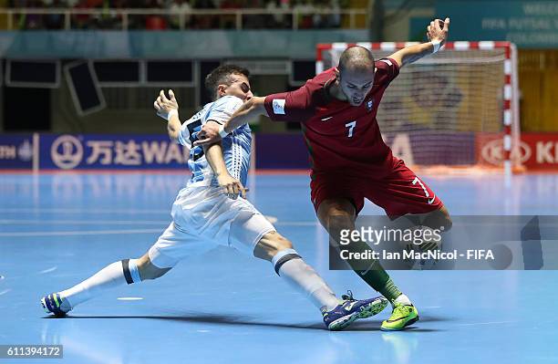 Maximilano Rescia of Argentina vies with Cardinal of Portugal during the FIFA Futsal World Cup Semi Final match between Argentina and Portugal at the...