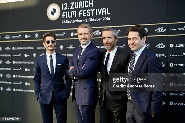 Pierre Niney, Lambert Wilson, Jerome Salle and Festival director Karl Spoerri attend the 'L'Odyssee' premiere during the 12th Zurich Film Festival on...