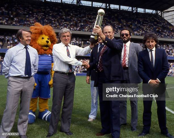 Chelsea FC Manager John Neal is presented with the 1983-84 Canon League Division Two trophy at the first game of the following season, Chelsea v...