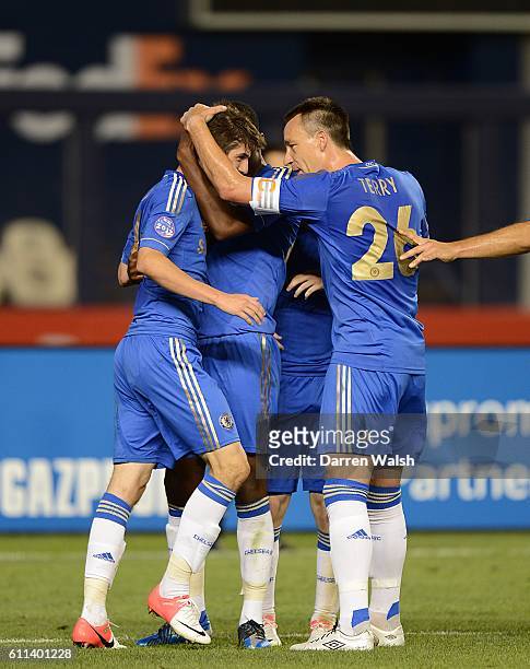 Chelsea's Lucas Piazon celebrates scoring his side's first goal of the game with teammate John Terry