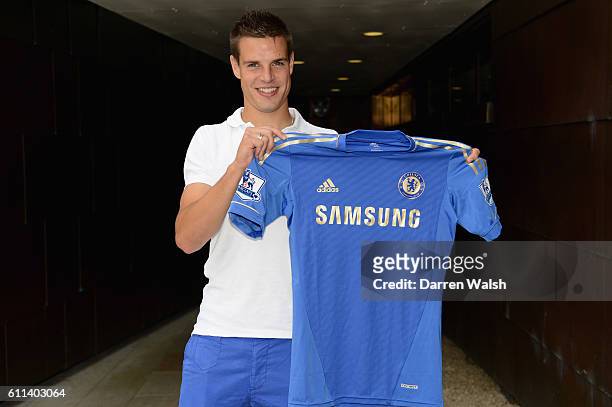 Chelsea's new signing Cesar Azpilicueta holds his new shirt after a training session at the Cobham Training Ground on 24th August 2012 in Cobham,...