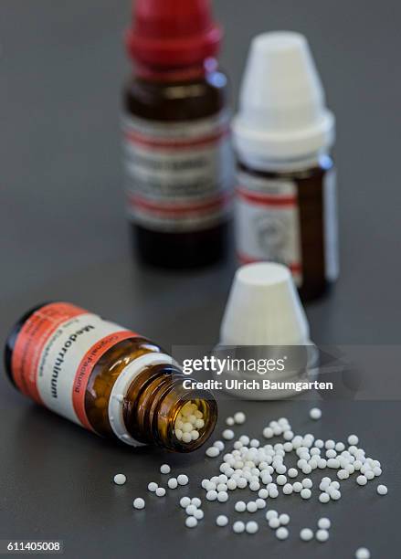 Homeopathy and naturopathy - if all else falls, the Naturopaths is the last hope for many people. The photo shows an overturned bottle and spilled...