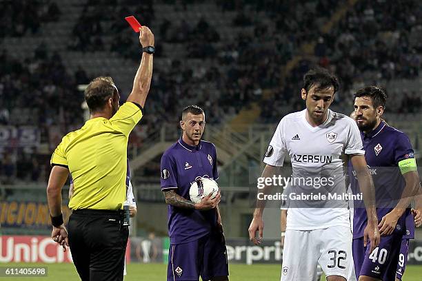 Referee Oliver Drachta shows the red card to Elvin Yunuszadä of Qarabag FK during the UEFA Europa League match between ACF Fiorentina and Qarabag FK...