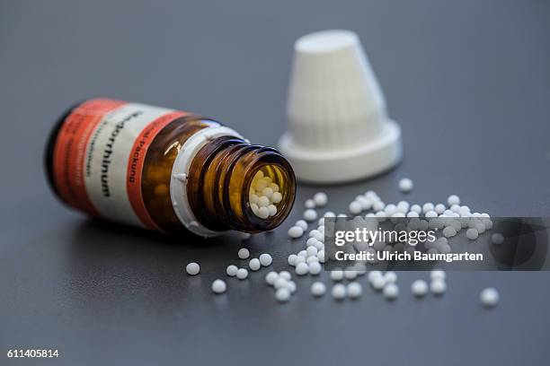Homeopathy and naturopathy - if all else falls, the Naturopaths is the last hope for many people. The photo shows an overturned bottle and spilled...