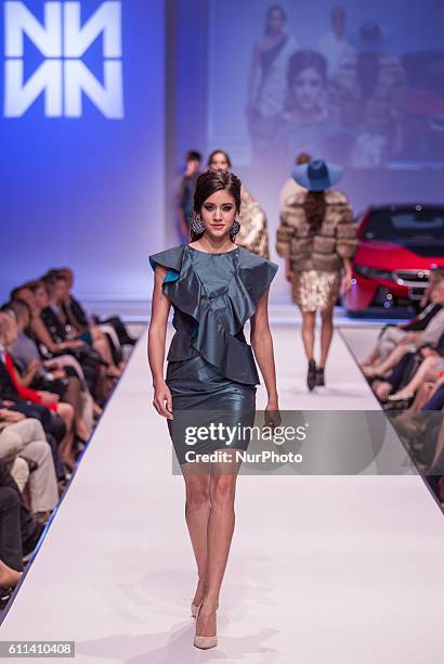 Modell walks the runway during Tamas Naray Fashion Show as part of BMW Wallis New Saloon Grand Opening Party on Sept 22, 2016 in Budapest, Hungary.