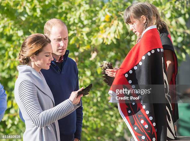 Prince William, Duke of Cambridge and Catherine, Duchess of Cambridge meet a peformer after watching a cultural welcome on September 28, 2016 in...