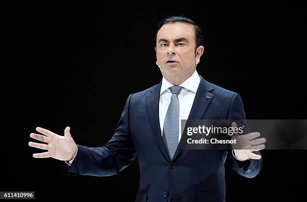 Carlos Ghosn, chief executive officer of Renault SA and Nissan Motor Co speaks on stage as he presents the new Nissan Micra automobile during the...