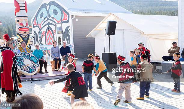 Prince William, Duke of Cambridge and Catherine, Duchess of Cambridge watch a cultural welcome on September 28, 2016 in Carcross, Canada.