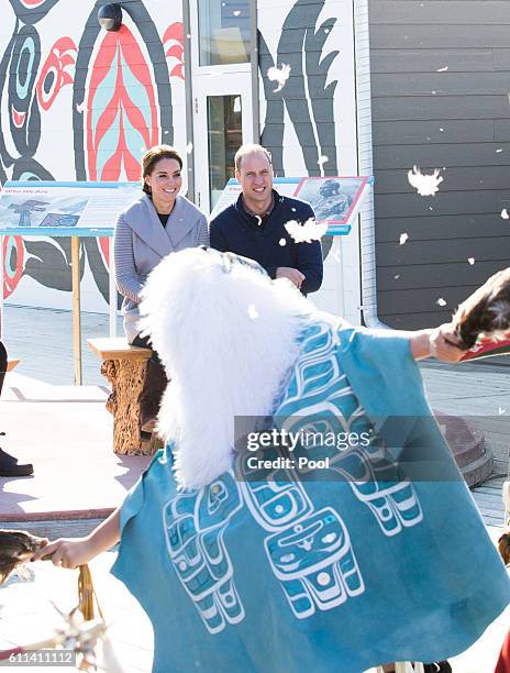 Prince William, Duke of Cambridge and Catherine, Duchess of Cambridge watch a cultural welcome on September 28, 2016 in Carcross, Canada.