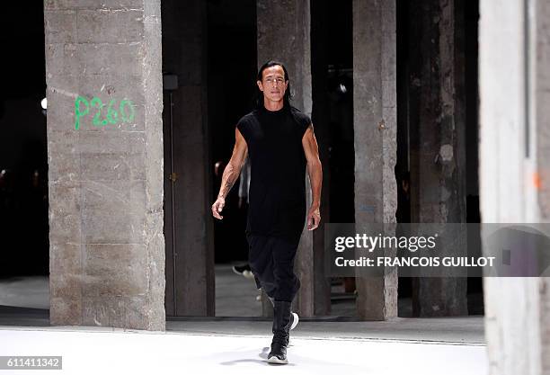 Fashion designer Rick Owens acknowledges the audience at the end of the 2017 Spring/Summer ready-to-wear collection fashion show, on September 29,...