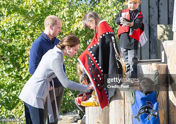 Prince William, Duke of Cambridge and Catherine, Duchess of Cambridge meet a peformer after watching a cultural welcome on September 28, 2016 in...