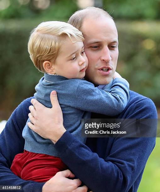 Prince George of Cambridge with Prince William, Duke of Cambridge at a children's party for Military families during the Royal Tour of Canada on...
