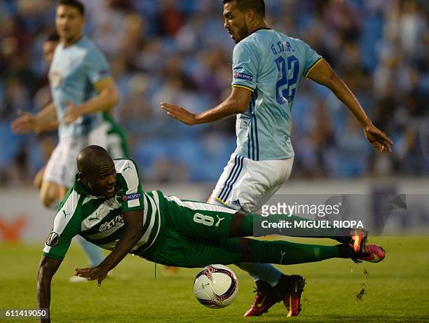 Panathinaikos' Colombian forward Victor Ibarbo falls next to Celta Vigo's Argentinian defender Gustavo Cabral during the Europa League Group G...