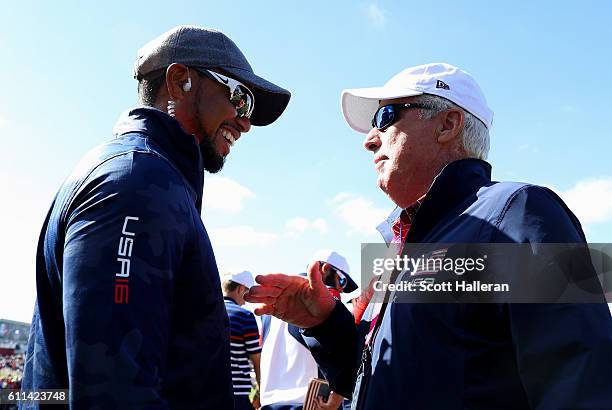 Vice-captain Tiger Woods of the United States speaks with Curtis Strange during practice prior to the 2016 Ryder Cup at Hazeltine National Golf Club...