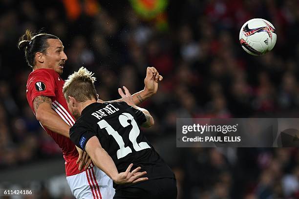 Manchester United's Swedish striker Zlatan Ibrahimovic vies with Zorya's Brazilian defender Rafael Forster during the UEFA Europa League group A...