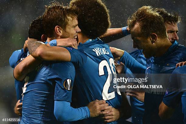 Zenit's forward Aleksandr Kokorin , Zenit's Belgian midfielder Axel Witsel and Zenit's Italian defender Domenico Criscito celebrate scoring a goal...