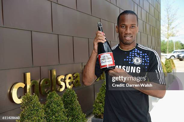 Didier Drogba of Chelsea with his Budweiser man of the match award at the Cobham training ground on May 15, 2012 in Cobham, England.