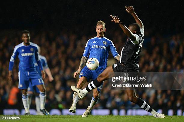 Raul Meireles of Chelsea clashes with Shola Ameobi of Newcastle United during the Barclays Premier League match between Chelsea and Newcastle United...