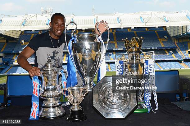 Didier Drogba of Chelsea with the FA Cup, Champions League Trophy, Carling Cup, Community Shield, Premier League Trophy on May 22, 2012 at Stamford...