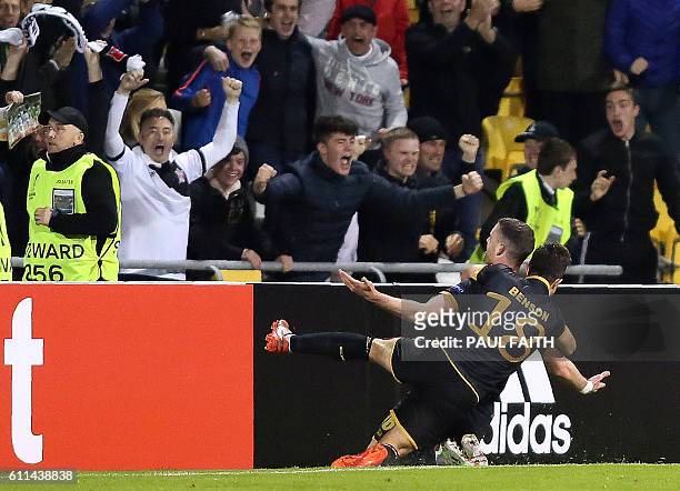 Dundalk's Irish striker Ciaran Kilduff celebrates with Dundalk's Irish midfielder Robbie Benson after scoring his team's first goal during the UEFA...