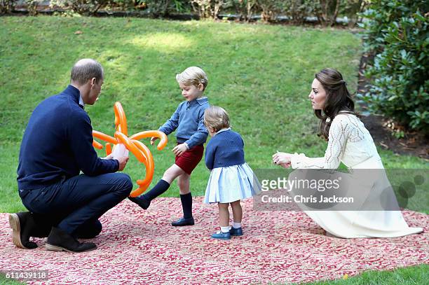 Catherine, Duchess of Cambridge, Princess Charlotte of Cambridge and Prince George of Cambridge, Prince William, Duke of Cambridge at a children's...