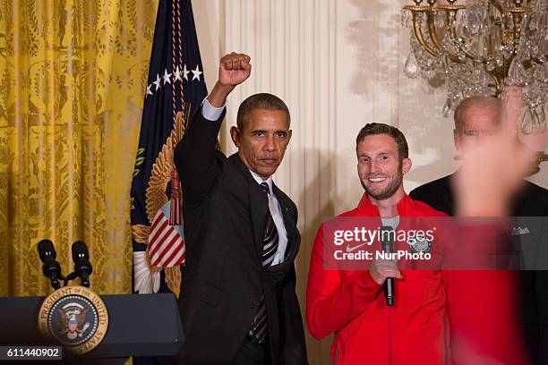 In the East Room of the White House in Washington, DC, September 29 President Barack Obama gives the &quot;Black Power&quot; salute, as Josh Brunais,...