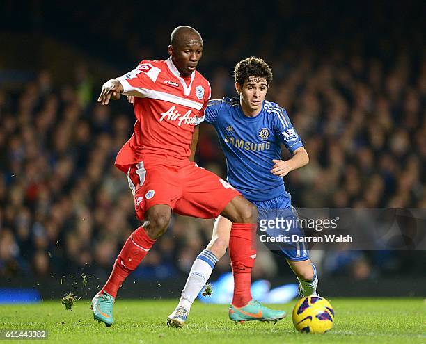 Chelsea's Emboaba Oscar and Queens Park Rangers' Stephane Mbia battle for the ball