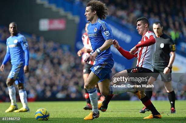 Brentford's Marcello Trotta and Chelsea's David Luiz battle for the ball
