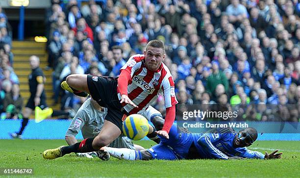 Chelsea's Demba Ba and Brentford's Harlee Dean battle for the ball in the penalty area