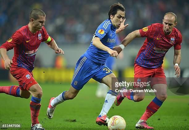 Steaua Bucuresti's Iasmin Latovlevici and Chelsea's Yossi Benayoun battle for the ball