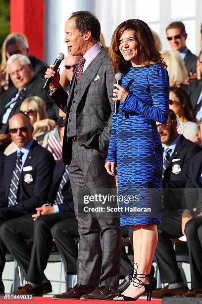 Hosts Dan Hicks and Michele Tafoya speak during the 2016 Ryder Cup Opening Ceremony at Hazeltine National Golf Club on September 29, 2016 in Chaska,...