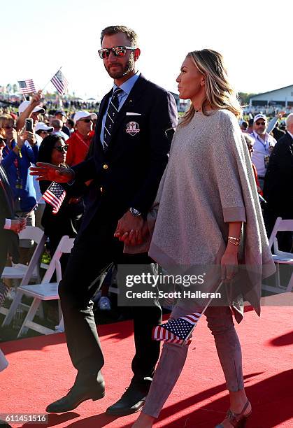 Dustin Johnson of the United States and Paulina Gretzky depart during the 2016 Ryder Cup Opening Ceremony at Hazeltine National Golf Club on...