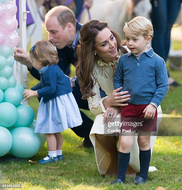 Prince William, Duke of Cambridge, Catherine, Duchess of Cambridge, Prince George of Cambridge and Princess Charlotte of Cambridge attend a...