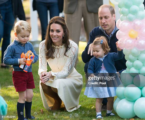 Prince William, Duke of Cambridge, Catherine, Duchess of Cambridge, Prince George of Cambridge and Princess Charlotte of Cambridge attend a...