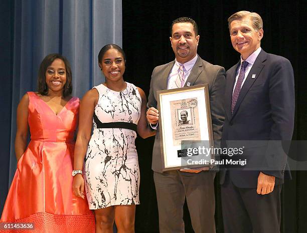 Writer/Director Deborah Riley Draper and Marc Pritchard , Procter & Gamble, award a commemorative plaque to the family of 1936 Olympian Ralph...