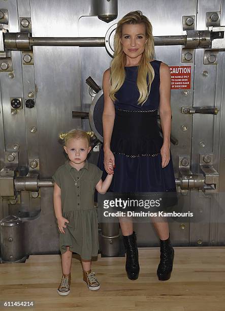 Tracy Anderson poses with her daughter Penelope Mogol at the Tracy Anderson Tribeca Studio Grand Opening Party at Tracy Anderson Tribeca Studio on...