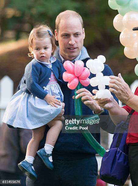 Prince William, Duke of Cambridge and Princess Charlotte of Cambridge attend a children's party for Military families during the Royal Tour of Canada...