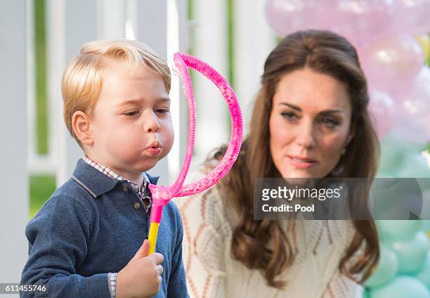 Catherine, Duchess of Cambridge and Prince George of Cambridge attend a children's party for Military families during the Royal Tour of Canada on...