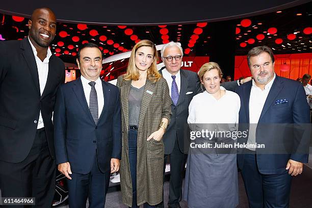Teddy Riner, Renault CEO Carlos Ghosn, Julie Gayet, Alain Ducasse, Helene Darroze and Pierre Herme pose in front of the new concept car TreZor during...