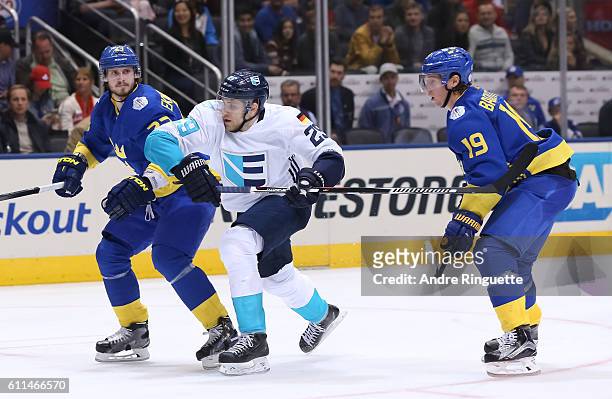 Oliver Ekman-Larsson of Team Sweden battles for position with Leon Draisaitl of Team Europe at the semifinal game during the World Cup of Hockey 2016...