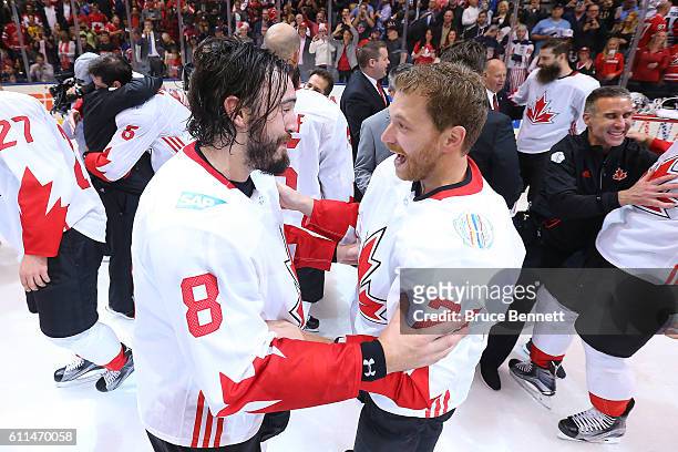 Drew Doughty and Corey Perry of Team Canada celebrate their win over Team Europe during Game Two of the World Cup of Hockey final series at the Air...
