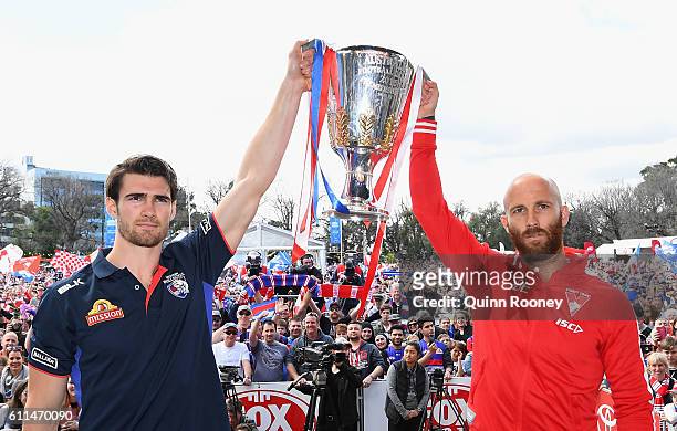 Easton Wood of the Bulldogs and Jarrad McVeigh of the Swans pose with the Premiership Cup on stage during the 2016 AFL Grand Final Parade on...
