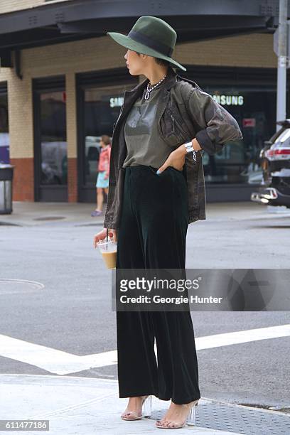 Lynn Kim Do wearing cargo green Isabella Rose Taylor cotton tee, dark green Zara velvet pants, Public Desire nude and clear strappy sandals with...
