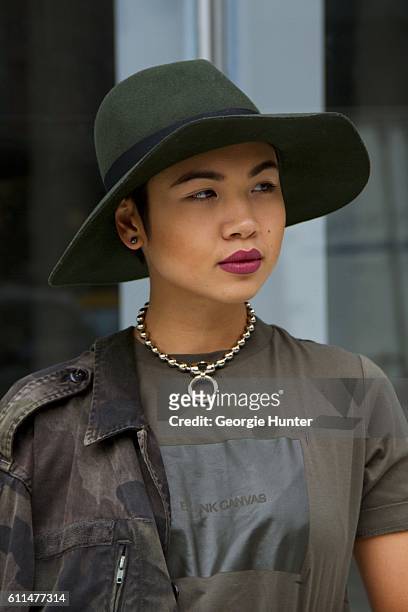 Lynn Kim Do wearing cargo green Isabella Rose Taylor cotton tee, chunky silver meridian ball chain Urban Outfitters choker necklace with ring...
