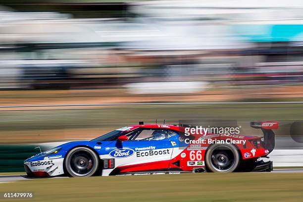 The Ford GT of Joey Hand, Dirk Muller, of Germany, and Sebastien Bourdais, of France, races on the track during practice for the the Petit Lemans...